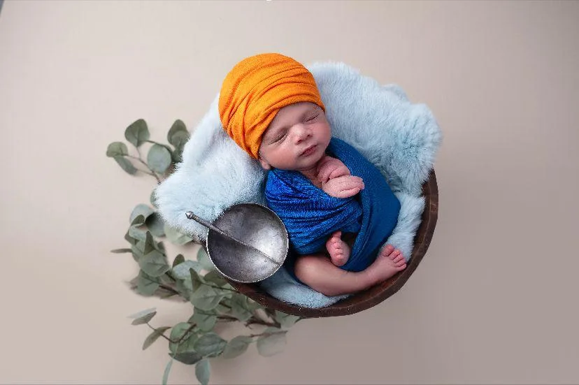 Janam Sanskaar Sikh Birth Ceremony A newborn is given sacred water blessed with the prayer of Japji Sahib and the touch of the iron Sword