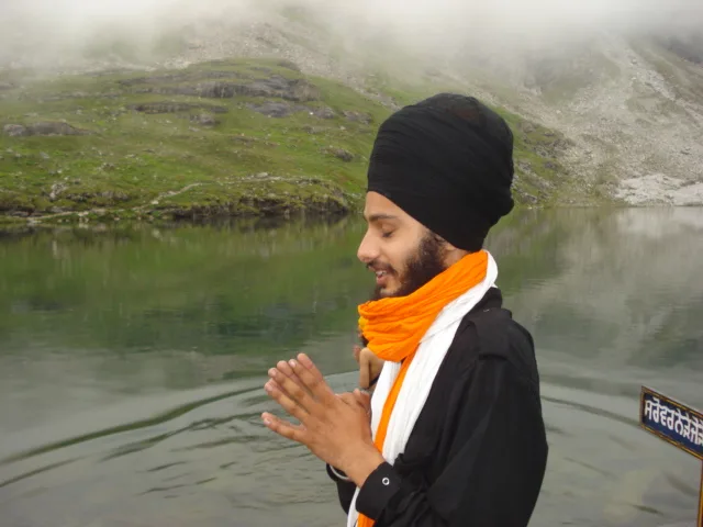 A Sikh having Sarowar Ishnaan bathing in water tank before having Darshan Holy Sight of Sri Guru Granth Sahib Ji